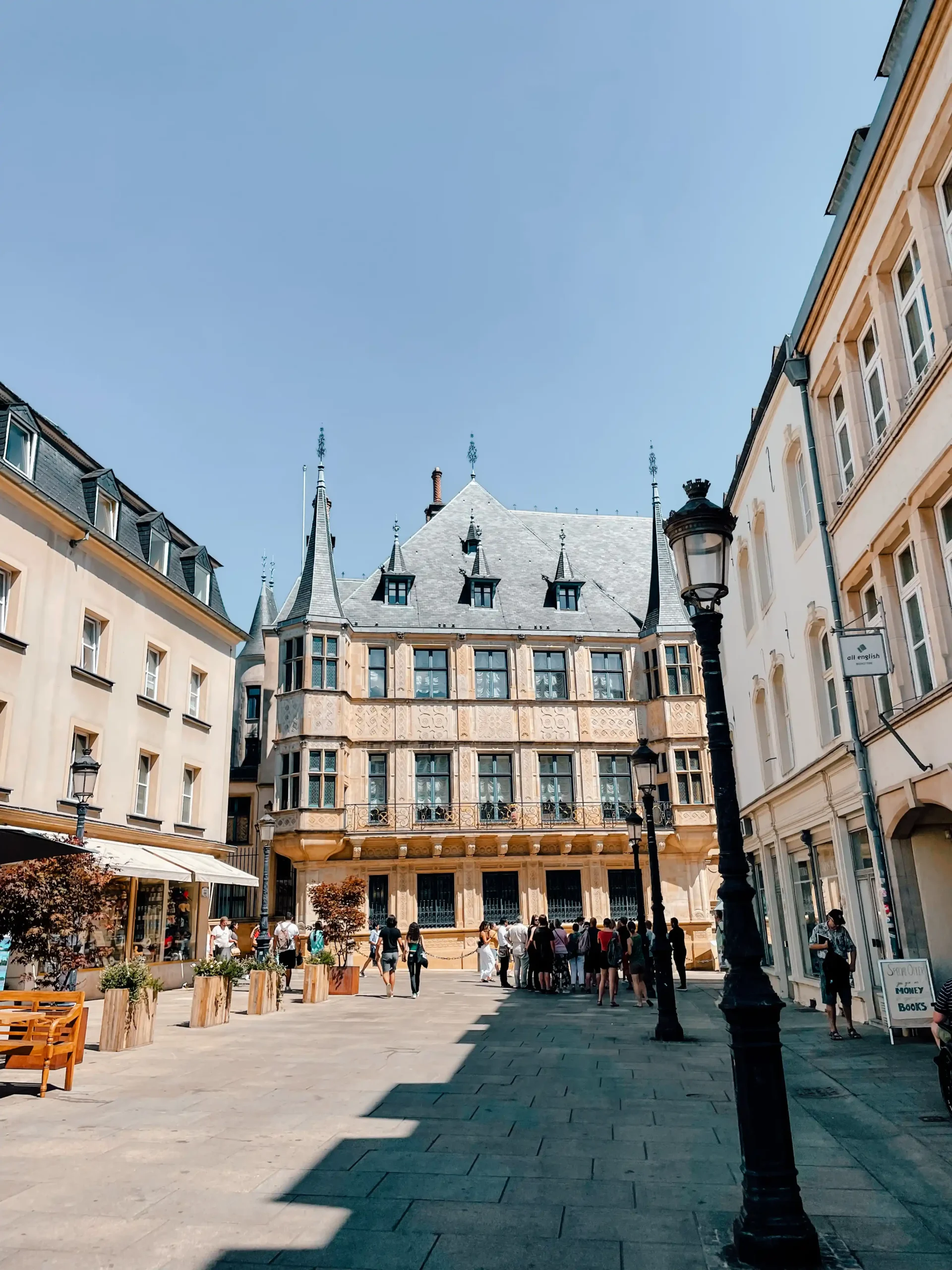 The Grand Ducal Palace in Luxembourg City sits at the end of a road with a historic lamp post in front