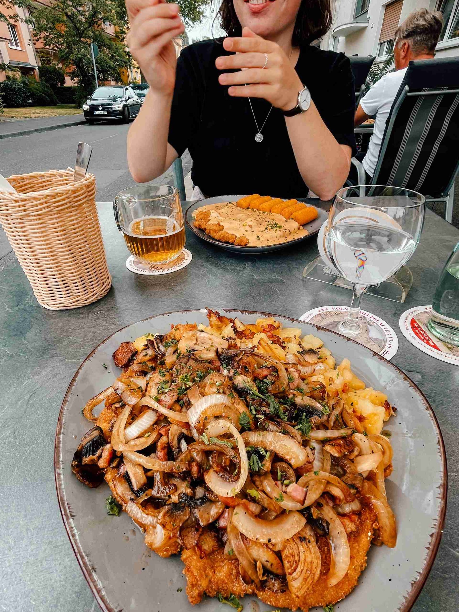 A photo of schnitzel smothered in toppings - a great meal fitting for the road trip budget