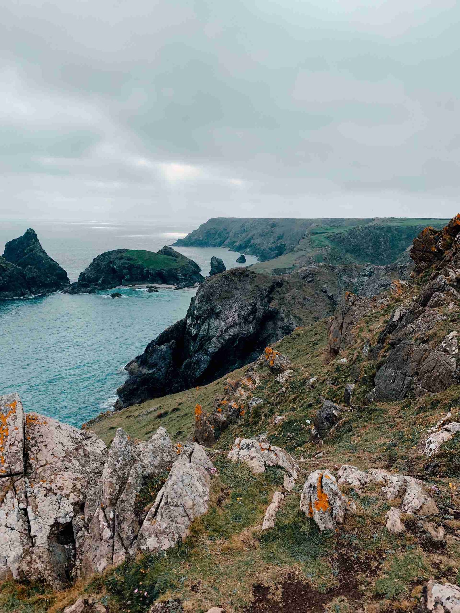 The moody Cornish Coast with jagged rocks and blue waters