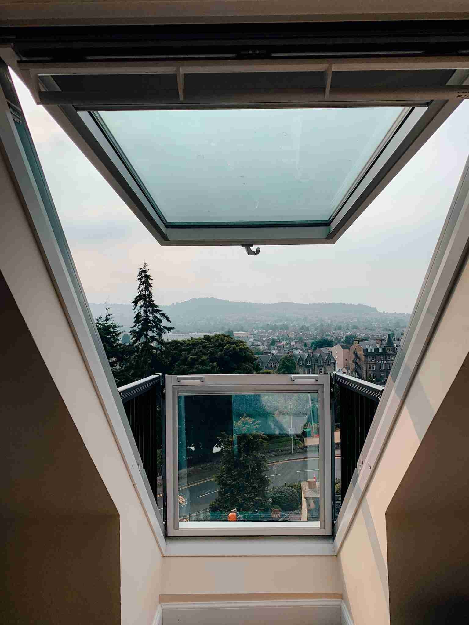 The view from inside our airbnb in Inverness, Scotland looking out the window. You can see the mountains and trees in the background