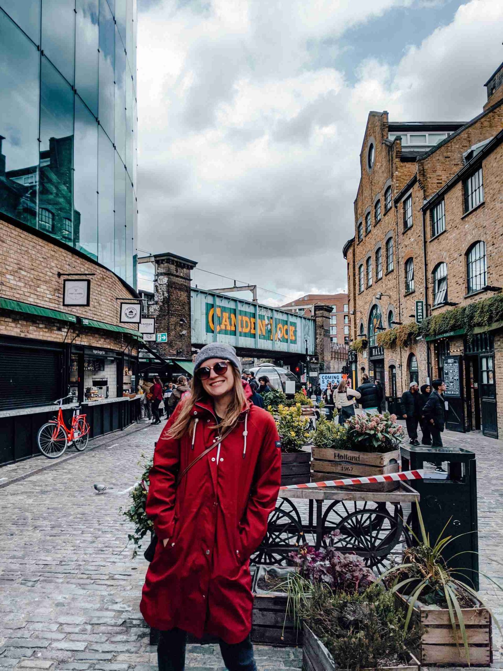 A girl standing in front of the Camden Lock, next to the Camden Market - one of the most iconic markets in London