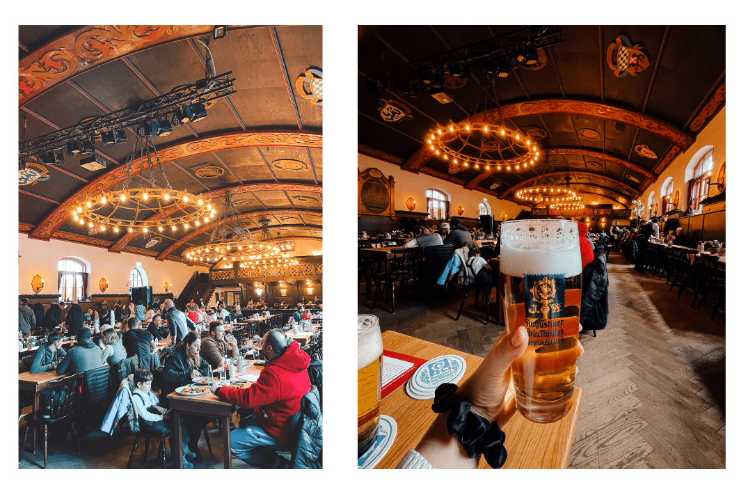 The inside of a beer hall in Munich features long communal wooden tables, glasses of beer, and wooden detailing along the ceiling and walls.