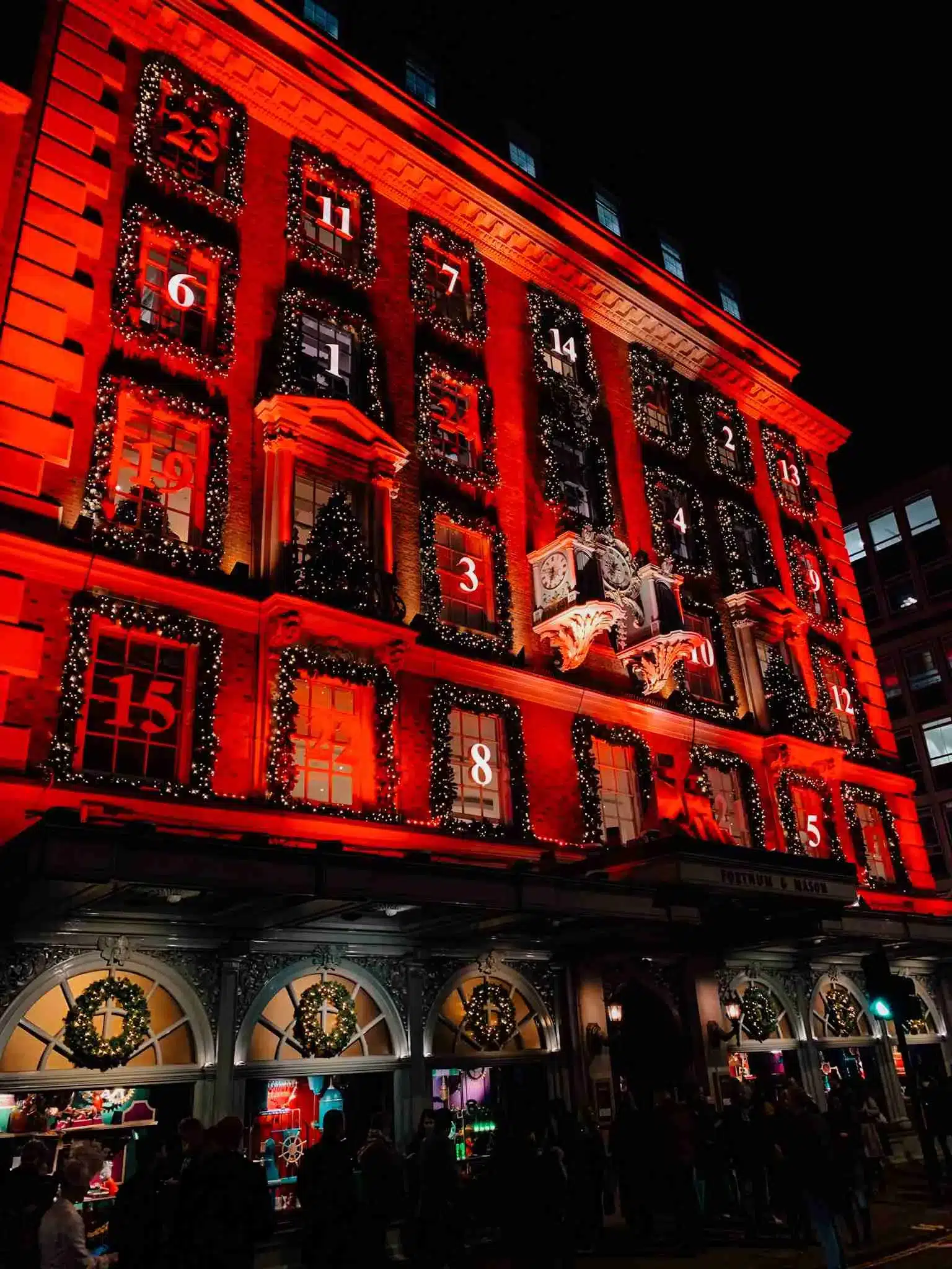 The Fortnum & Mason storefront in London decorated as an advent calendar, with illuminated numbered windows counting down to Christmas