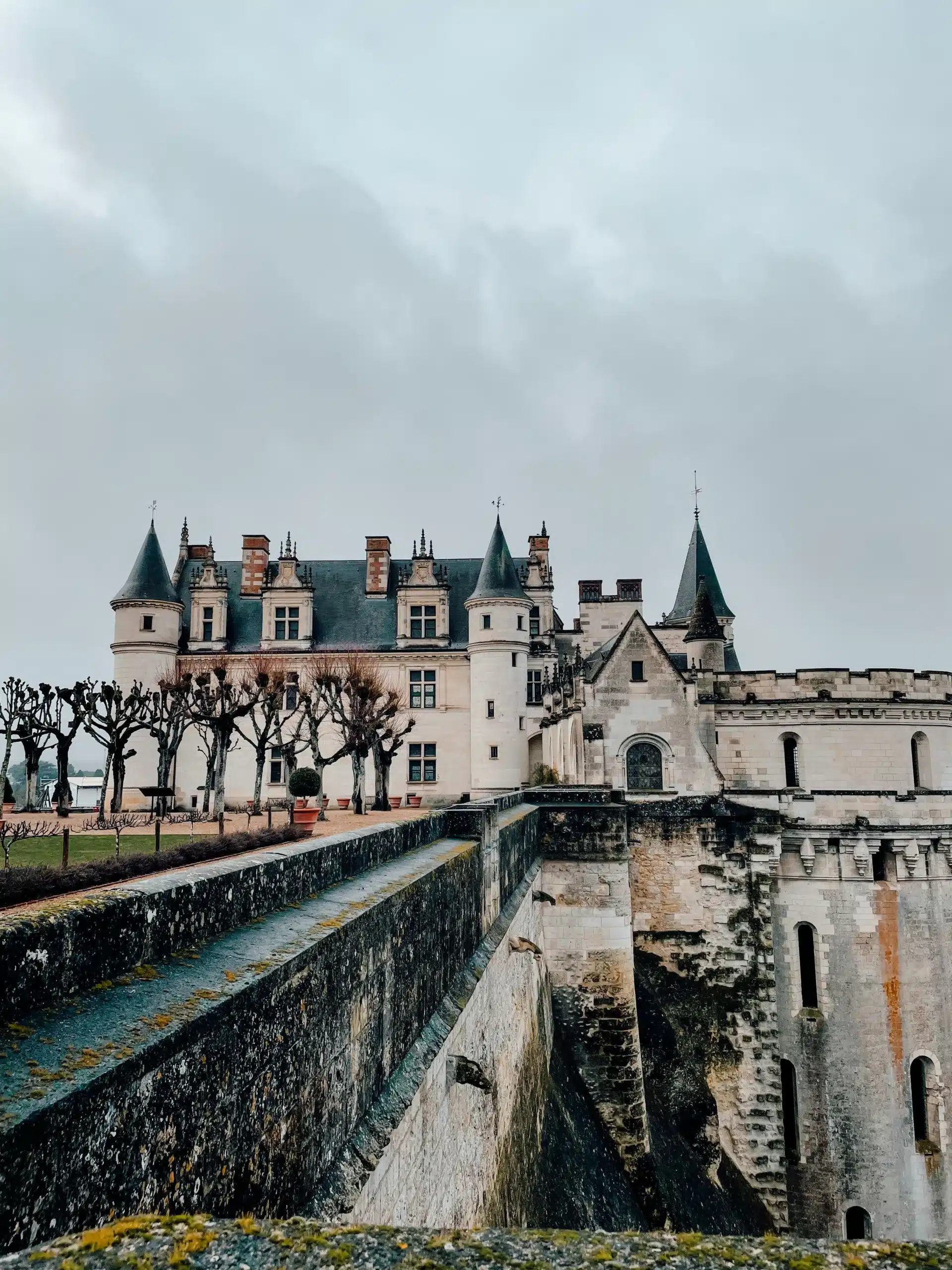 A white french castle in the Loire Valley on a cloudy day