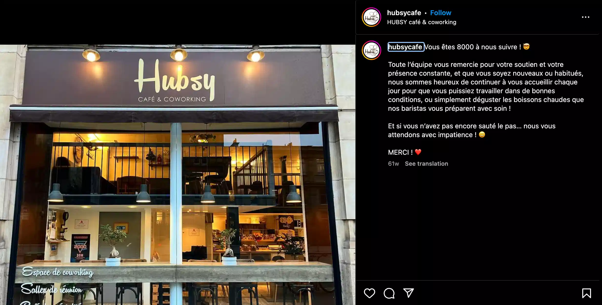 the outside of a coworking cafe in Paris. You can see the various seating options through the window