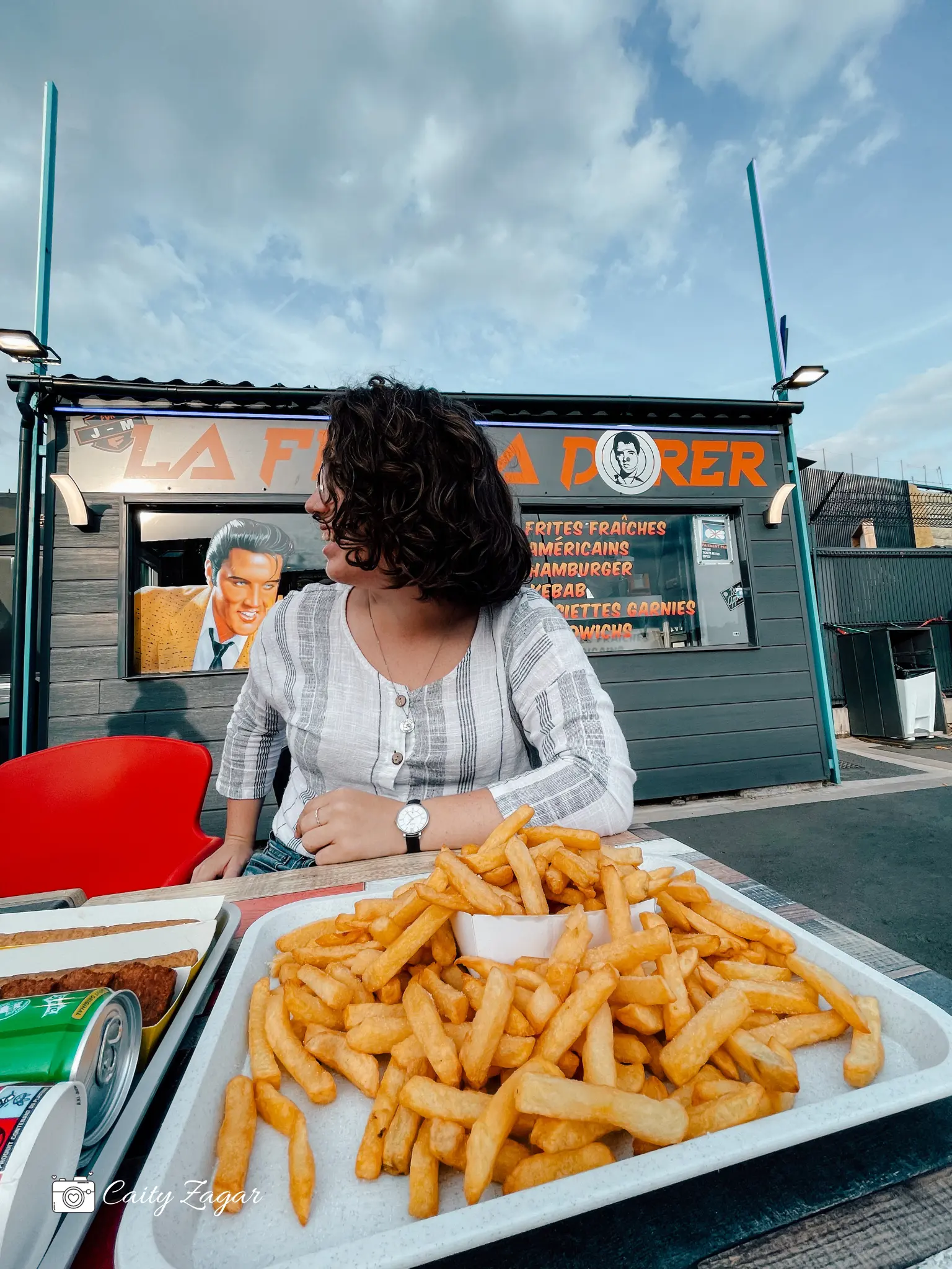 a massive plate of french fries served at a friterie